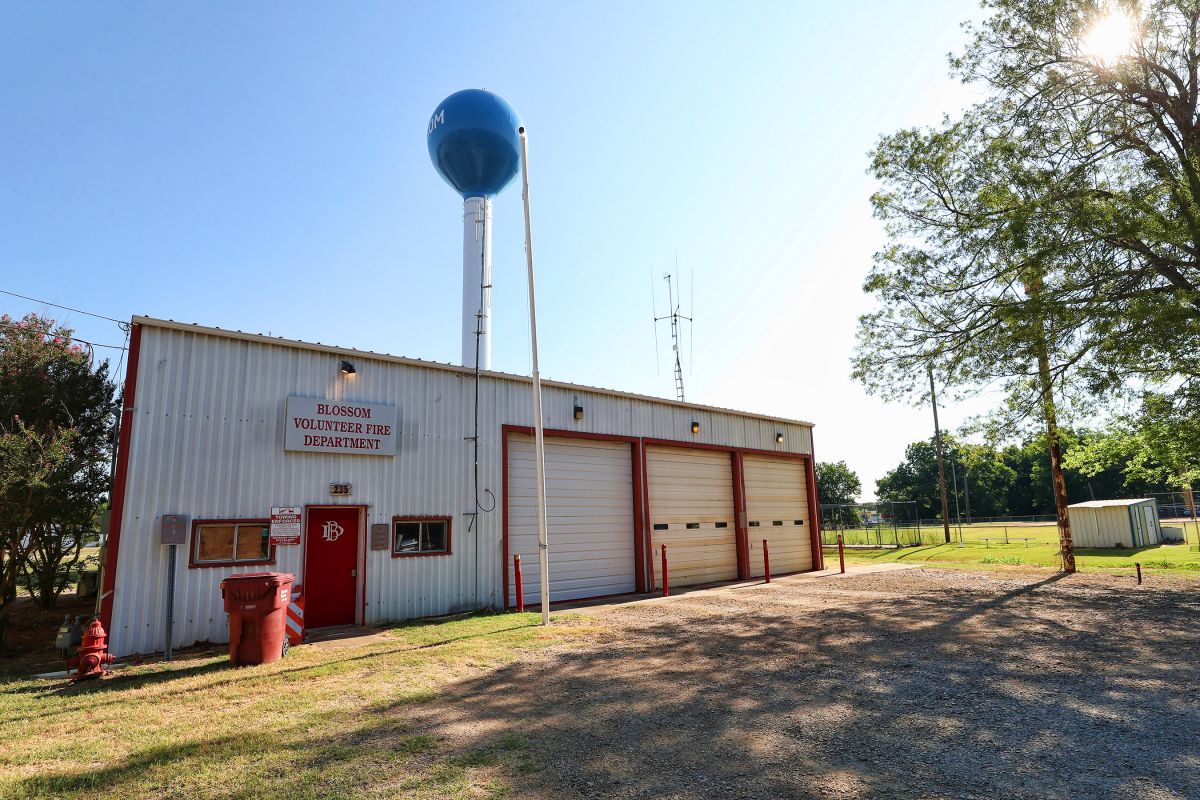 front view of white metal building fire department